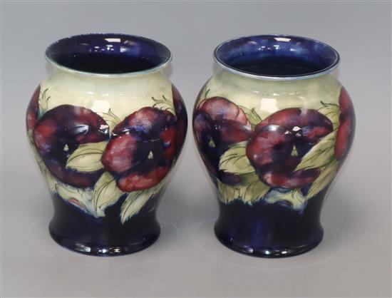 A pair of Moorcroft Pansy vases height 17cm
